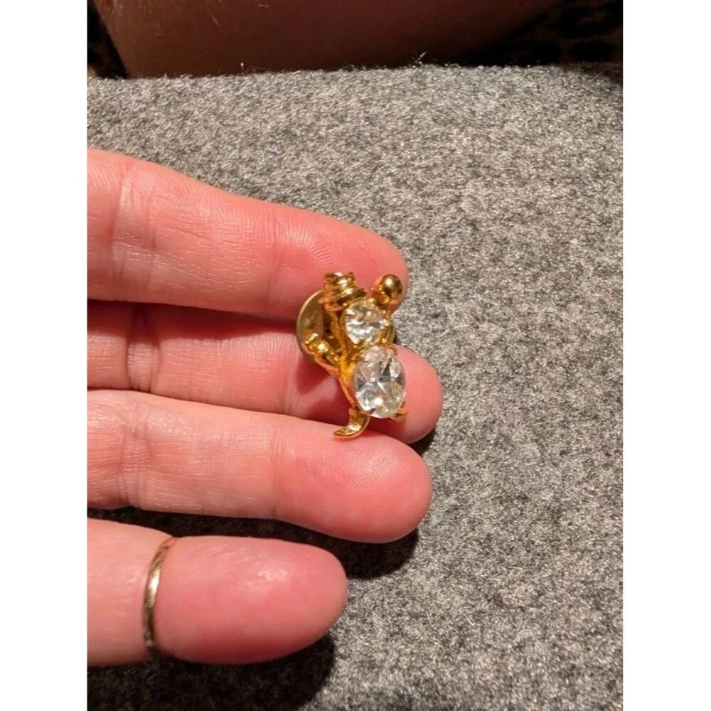 Gold and CZ clown pen or Thai tech?